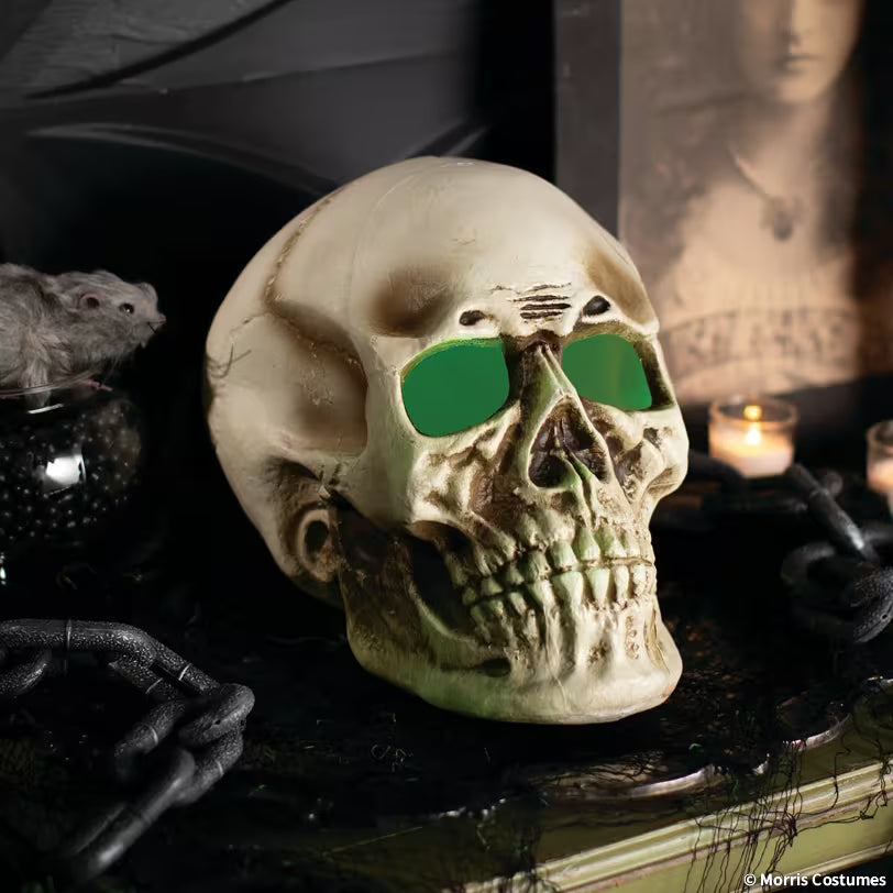 Giant light-up skull with illuminated eyes in a Halloween display
