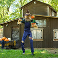 Seven-foot Rotten Harvester scarecrow animatronic with pumpkin companion, full display