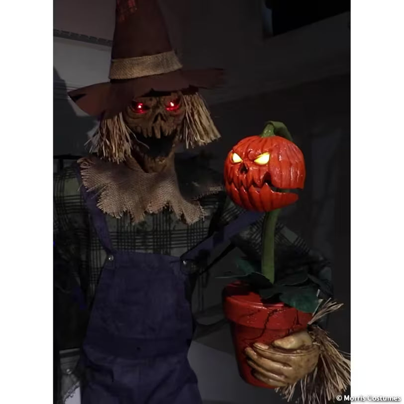Rotten Harvester and pumpkin companion with illuminated eyes, close-up